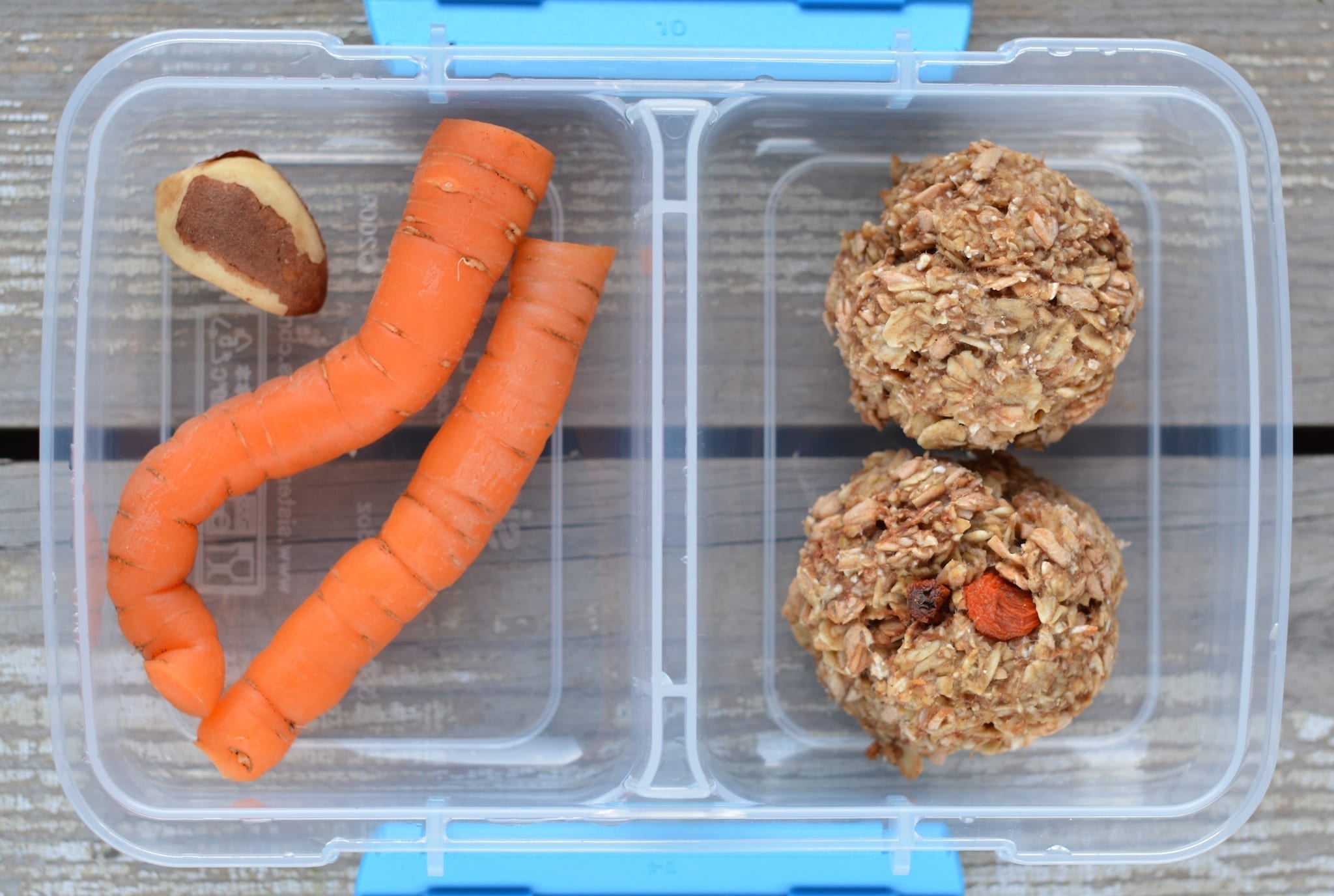 Snack box with carrots, cookies and a nut